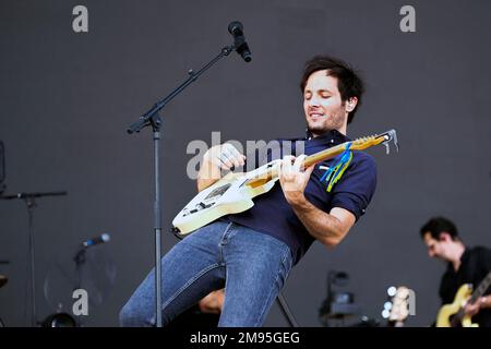 Carhaix (Brittany, north-western France), July 17, 2022: singer Vianney on stage and crowd of festival-goers on the occasion of the Vieilles Charrues Stock Photo