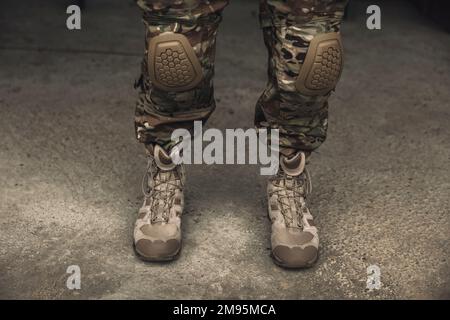 Close up picture of soldiers feet in boots Stock Photo