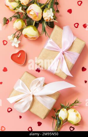 Valentine's Day, Women's Day, birthday, mothers day greeting card background with handmade present box and spring flower on pink background. View from Stock Photo