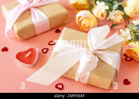 Valentine's Day, Women's Day, birthday, mothers day greeting card background with handmade present box and spring flower on pink background. Stock Photo