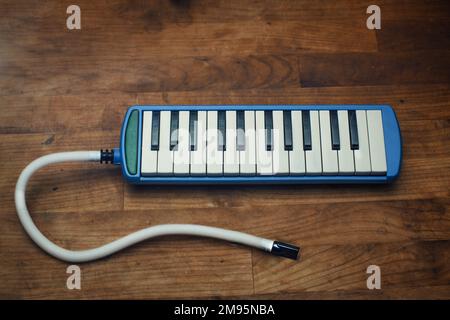 Keyboard wind musical instrument. Wooden musical organ. Metal parts of ...