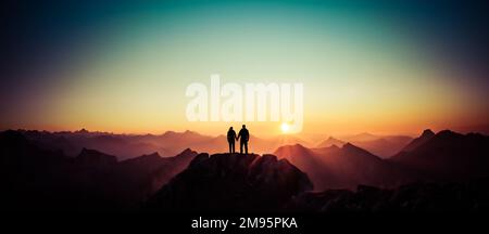 Silhouette Couple of man and woman reaching summit enjoying freedom and looking towards mountains sunset. Alps, Allgaeu, Bavaria, Germany. Stock Photo