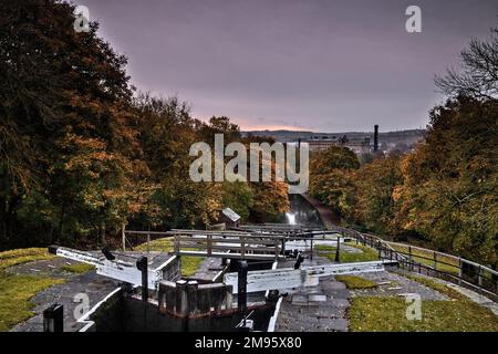 An aerial shot of the Five Rise Locks in Bingley and yellow trees captured on an autumn day Stock Photo