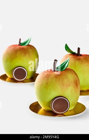 Dessert in shape of apples on golden serving cardboard Stock Photo