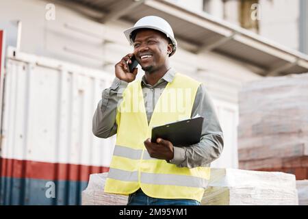 I need your equipment. a young businessman using his smartphone while on a construction site. Stock Photo