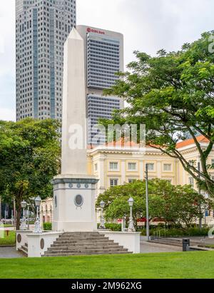 Dalhousie Obelisk at Empress Place with UOB and OCBC office towers in background, in centre of Singapore Stock Photo