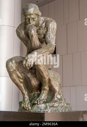 Bronze statue The Thinker by Auguste Rodin on public display in undercroft of OUE Bayfront Building in CBD or Singapore Stock Photo