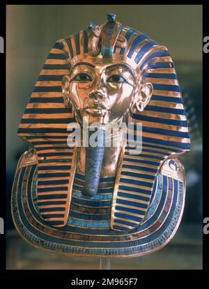 The famous mask of Pharoah TUTANKHAMUN, ruler of the 18th Dynasty of Egypt 1361 - 1352 BC, (Egyptian Museum, Cairo), made of solid gold, with inlaid glass and lapis lazuli. Stock Photo