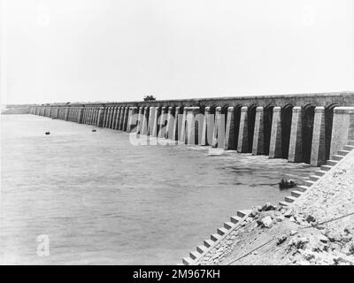 The Assiut or Asyut Barrage damming the River Nile in Egypt (seen here from downstream), about 350 miles downstream of the Aswan Dam. Designed by British engineer Sir William Willcocks, who also designed the Aswan Dam, it was built between 1898 and 1903. Stock Photo