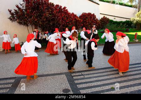 Dancers belonging to a folklore group from Campanario, performing an old dance in the street in Funchal, the capital city of Madeira. Stock Photo