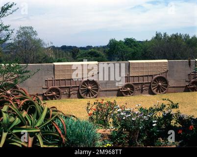 Part of the Voortrekker Monument in Gauteng Province, Pretoria, South Africa, showing Voortrekker ox wagons in the wall surrounding the Monument -- in total there are 64 of these wagons, made out of decorative granite.  The Monument was built to honour the Voortrekkers (Pioneers) who left the Cape Colony for the Great Trek in their thousands between 1835 and 1854.  Construction began in 1937, and the Monument was inaugurated in 1949. Stock Photo