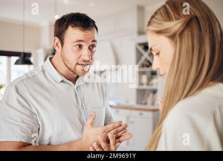 Argument an exchange of ignorance. a young couple having an argument at home. Stock Photo