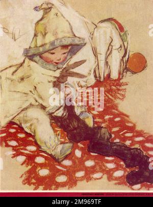 A little boy wakes up on Christmas morning and begins rooting around in the stuffed Christmas stocking left behind by Santa Claus. Stock Photo