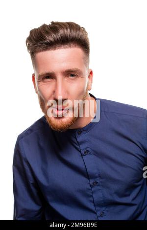 Attractive young man wearing blue shirt, isolated over a white background. Stock Photo