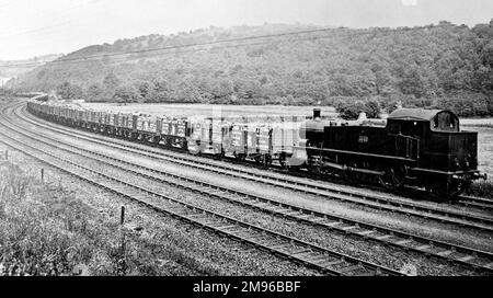 A one hundred truck coal train on the Great Western Railway, somewhere in South Wales.  The trucks belong to the John Lancaster & Co colliery company of Nant-y-glo (Nantyglo), and bear a griffin symbol. Stock Photo