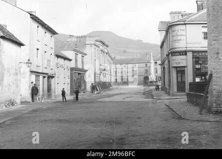 A view up the High Street in the town centre, Crickhowell, Powys, Mid Wales, showing the Bear Hotel at the top, and various shops on either side. Stock Photo