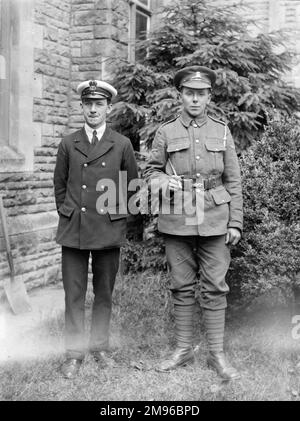 Two brothers in their uniforms, prepared for war, one in the Royal Navy (left), the other in the Royal Welsh Fusiliers (right). Stock Photo