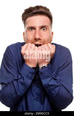 Attractive young man wearing blue shirt, isolated over a white background. Stock Photo