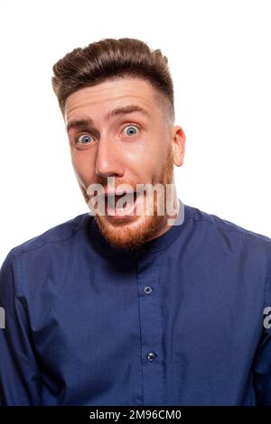 Attractive young man wearing blue shirt, isolated over a white background. Stock Photo