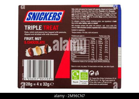 List of food ingredients and nutrition information on back of pack of Snickers Triple Treat Fruit - food labelling packaging label Stock Photo