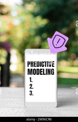 Handwriting text Predictive Modeling, Word Written on maintenance strategy driven by predictive analytics Stock Photo
