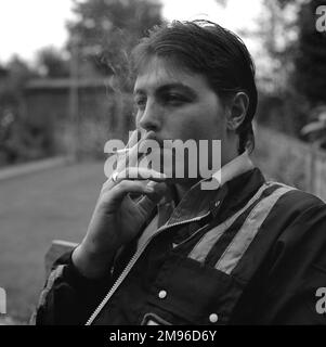 Fashion of the 1970s. A young man wearing the typical fashion of the ...