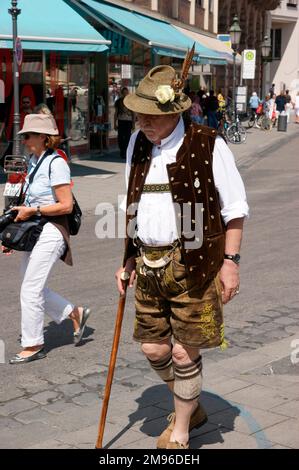 Elderly Bavarian man wearing traditional lederhosen - Munich, Germany. Stock Photo