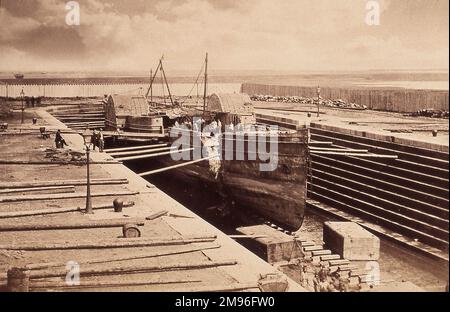 Wolf, mail paddle steamer owned by J and G Burns in dry dock after salvage by Harland and Wolff Stock Photo