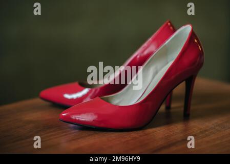 red high-heeled shoes close-up on the table for the bride Stock Photo