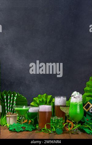 St Patrick's Day bar menu background. Set various golden, green beer glasses, different cocktails and drinks, with St. Patrick's Day party decor and a Stock Photo