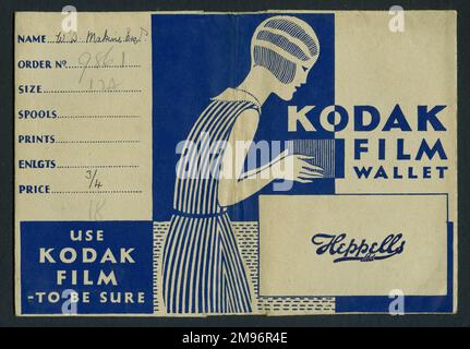 Photographic print wallet, advertising Kodak Film, and the developers, Heppells Ltd.  The art deco design shows a young woman with bobbed hair, taking a photo with a box camera. Stock Photo