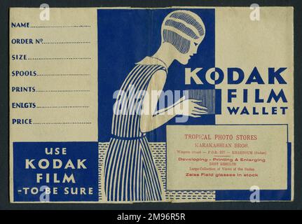 Photographic print wallet, advertising Kodak Film, and the developers, Karakashian Bros of Khartoum, Sudan.  The art deco design shows a young woman with bobbed hair, taking a photo with a box camera. Stock Photo