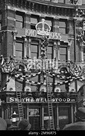 Silver Jubilee decorations on a building at Ludgate Circus, London. Stock Photo