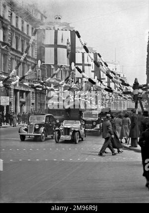 Silver Jubilee street scene in London, with garlands and flags. Stock Photo