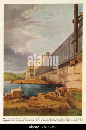 The construction of Robert Stephenson's tubular railway bridge across the Conway River, North Wales.  Preparations for raising the second tube.  Coloured lithograph by G Hawkins Stock Photo