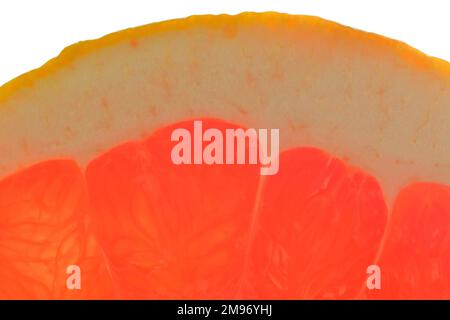 Close-up of red juicy grapefruit on white background. Grapefruit  slice isolated on white background. Macro horizontal image. Stock Photo