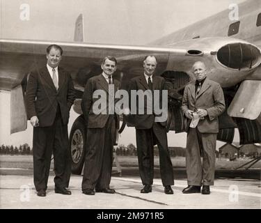 From left: Major Frank Halford, Sir Frank Whittle, Sir Geoffrey de Havilland and C.C. Walker in front of the first prototype de Havilland Comet airliner. Stock Photo
