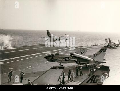 A Douglas A3D-2 Skywarrior, 138953, departs from USS Independence past a Vought F8U Crusader. Stock Photo