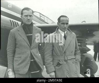 Charles William Anderson Scott, AFC, 1903-1946, left, and Tom Campbell Black, 1899-1936, winners of the MacRobertson Air Race, London to Melbourne race, in 1934, in front of their de Havilland DH88 Comet racer. Stock Photo