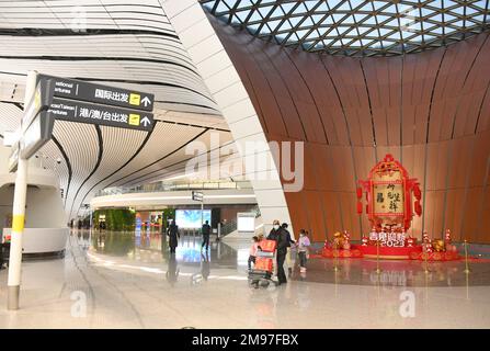 (230117) -- BEIJING, Jan. 17, 2023 (Xinhua) -- This photo taken on Jan. 17, 2023 shows an interior view of the Beijing Daxing International Airport in Beijing, capital of China.  With the take-off of the CZ309 flight to Hong Kong, the Beijing Daxing International Airport on Tuesday resumed the operation of international passenger flights after China continuously optimized COVID-19 epidemic prevention and control policies.    As Beijing's newest airport, the Beijing Daxing International Airport became operational on September 25, 2019. From March 14, 2020, the airport's international flights we Stock Photo