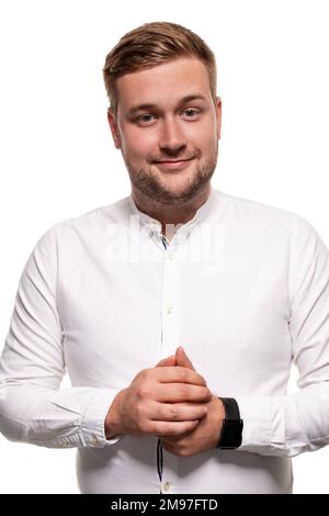 Close up horizontal portrait of a handsome man with a beard, stylish haircut, wearing a white shirt, isolated on a white background Stock Photo