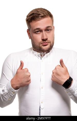 Close up horizontal portrait of a handsome man with a beard, stylish haircut, wearing a white shirt, isolated on a white background Stock Photo