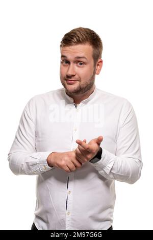 Close up horizontal portrait of a handsome man with a beard, stylish haircut, wearing a white shirt, isolated on a white background Stock Photo