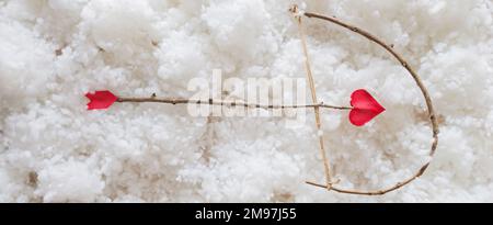 white clouds background with bow and heart arrow. Happy Valentines day concept. Horizontal banner for web design Stock Photo