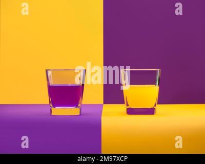 Two glass of orange juice and grape juice on a checked background Stock Photo