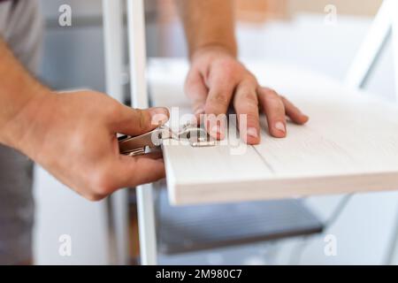 Close-up carpenter process of wood door hinge installation Stock Photo