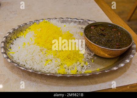 Food in Iran - Ghormeh Sabzi with saffron rice Stock Photo