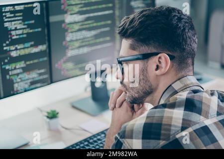 Photo of clever pensive freelancer wear eyeglasses hands arms chin creating safety app modern gadget indoors workplace workstation loft Stock Photo