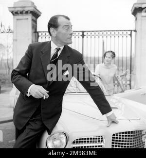 Advertisement for Life cigarettes -- male and female models (Helen Connor and Christopher Powell) with Facel Vega car. Stock Photo