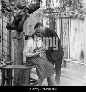 Advertisement for Cadbury's Golden Key -- male and female models (Barry Trengove and Geraldine Hill) posing. Stock Photo